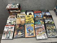 DVDs arranged on table with clear titles visible, showing variety of TV shows and movie DVDs