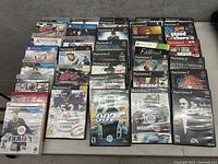 Photo of the collection showing mostly PlayStation 2 games alongside a few PlayStation 4 and Xbox 360 games.