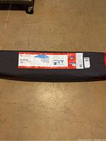 Photo of entire packed sun shelter in gray bag with label of brand and size visible