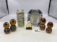 Overview of all items including 6 Kutani vases, Toyo-style frame, 4 wooden dolls, and Buddha figurine