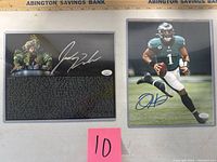 Two 8x10 photographs in acrylic sleeves side by side with measurement scale