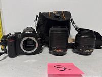 Overall view: Nikon D5000 body, two lenses, Lowepro bag