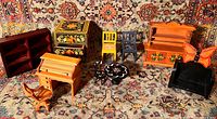 Full group of 10 handmade dollhouse furniture pieces including desks, chairs, cabinets, and table on a patterned carpet background.