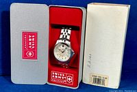 Victorinox Swiss Army watch in original silver box with red interior and card, plus outer cardboard box