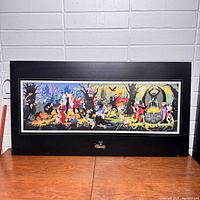 Full view of the laminated Disney Villains poster mounted on board with black frame and Disney Villains emblem.