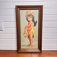 Full view of the framed paint by number artwork showing the Hawaiian girl in her flower crown and lei.