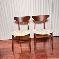 Front view of both chairs showing curved back splats and upholstered seats