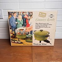 Box and product image showing West Bend vintage Country Kettle cooker in avocado green, model number 3366 with Teflon coating