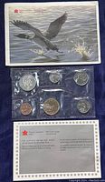 Photo of the front side shows six Canadian coins sealed in original protective plastic with accompanying information card and illustrated envelope featuring a Canada Goose.