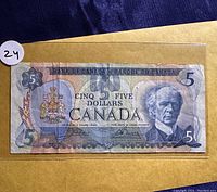 Front side of the 1979 Canadian five dollar bill showing the portrait of Sir Wilfrid Laurier and bank details.