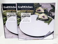 Two boxed Craft Kitchen Classic Collection serve platters, showing packaging with product name and usage information.