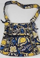 Front view of the Vera Bradley quilted cotton crossbody handbag with Ellie Blue Elephants pattern, showing the fabric strap and front zippered pocket.
