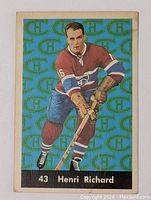 Front of 1961-62 Parkhurst Henri Richard hockey card showing player image, background logo pattern, and card number 43
