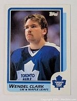 Front of 1986-87 Topps Wendel Clark rookie hockey card showing player portrait in Toronto Maple Leafs jersey, Topps logo, and card framing.
