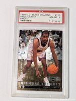 Front view of 1998 Upper Deck Black Diamond Vince Carter rookie card graded PSA 8 in protective case.
