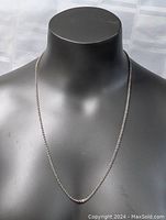 Front view of sterling silver chain necklace displayed on black mannequin bust showing full length and link detail.
