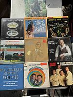 Lot of 12 vintage vinyl records featuring country and gospel music artists with detailed album covers.