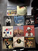 Photo of lot showing 10 vintage vinyl record covers including classical, jazz, tango, organ, and popular music genres.