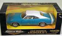 1969 Dodge Charger R/T die cast model car in box with yellow insert and clear display window. Box has wear and is taped closed.
