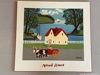 Full view of the mounted print showing the colorful folk art house with horses and cart, signed Maud Lewis.