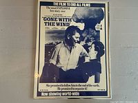 Full view of framed black and white spoof poster showing Reagan and Thatcher with nuclear explosion background and spoof title.