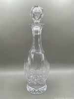 Full view of the 13-inch tall Waterford Crystal decanter with stopper, showing clear cut crystal design and elegant shape.