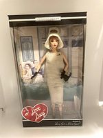 Full view of unopened boxed Barbie Collector Edition doll, Lucille Ball as Lucy Ricardo from I Love Lucy with minor wear on packaging.