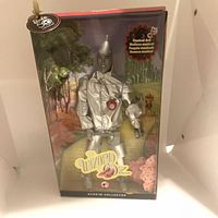 Front view of the Barbie Collector Edition Wizard of Oz Tinman doll in original packaging showing clear display and box graphics.