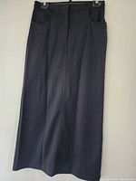 Full view of the black skirt, showing length and overall design