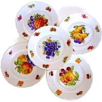 Set of five vintage Bohemian dessert plates arranged in a circular pattern showing vibrant fruit designs and gold trim edges.