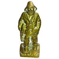 Front view showing well-defined fisherman figure in brass finish with detailed clothing and facial features.