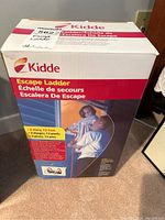 Original box of Kidde Escape Ladder showing front side with product image and details about 2 story and 13 feet size.