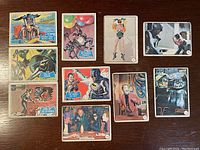 Front sides of ten 1966 vintage Batman trading cards featuring colorful illustrations and photos of characters and scenes from the Batman TV show.