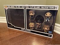 Sealed full boxed set of 5 AC/DC Back In Black Funko Pop figures with visible band member figures and album artwork on box.