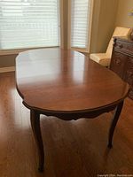 Front angle of assembled table showing cherrywood finish and cabriole legs
