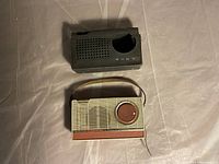 Sony TR-609 transistor radio and black carrying case viewed from top, placed on surface
