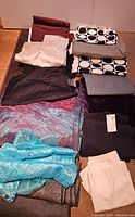 All fabrics folded and arranged showing assortment of colors and patterns