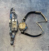 Two vintage Bulova ladies wristwatches, showing rectangular and square watch faces and bands