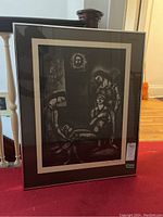 Full frontal view of the framed Georges Rouault print showing the artwork with black and white figures and signature visible.