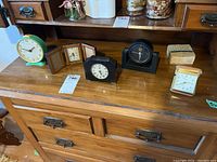 Overview of all five clocks including desk and travel models