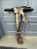 Front view of breaker with T-handle and chisel attachment