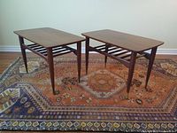 Front perspective of both side tables on rug