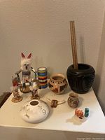 Overview of all items including pottery, dolls and miniatures