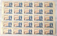 Full block of Canadian 5 cent Colombo Plan stamps showing the two figures and blue Canada on a reddish background, perforated edges visible.