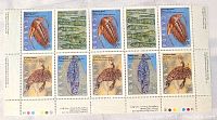 Flat view of the full Canadian stamp block showing six stamps with detailed images of marine fossils.