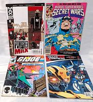 All four comics laid out showing front cover including Punisher Max, Secret Wars, G.I. Joe and Transformers.