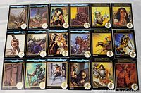 Front view of 21 Advanced Dungeons & Dragons trading cards laid out flat showing various characters and magical items.