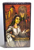 Front view of the unopened Labyrinth themed tarot card box showing the detailed illustrated artwork of two main characters, an owl, a castle, and labyrinth maze background.