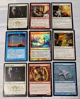 Photo shows 9 Magic the Gathering cards laid out in a 3x3 grid. Cards include Lunarch Mantle, Sokenzan Spellblade, Ethersworn Canonist, Utopia Sprawl, Ghost-Lit Raider, Chosen by Heliod, a second Lunarch Mantle, Grathmaker Initiate, and Spiked Starfish.