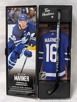 Full view of the Mitch Marner collector's mini hockey stick set including the jersey and display with Tim Hortons branding.